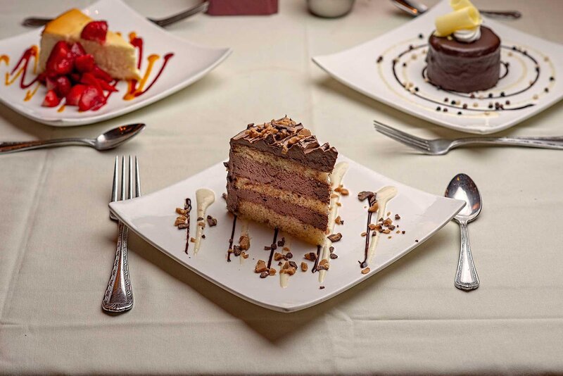 Multiple desserts with focus on chocolate cake